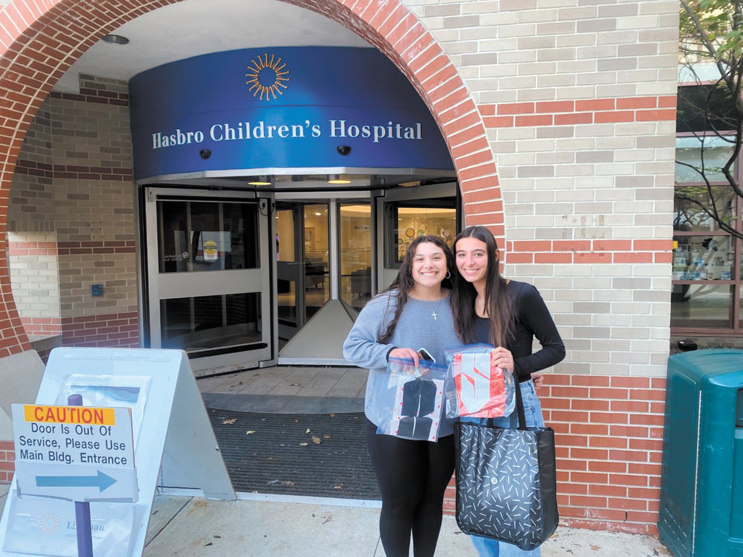 FOR ALL THE SUPERHEROS: Juniors Sofia Marella and Thea Marses created superhero capes for kids in Hasbro Children’s Hospital as part of their class project. (Submitted photo)